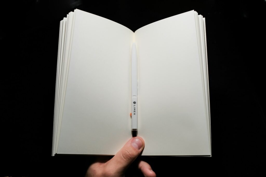 person holding white printer paper